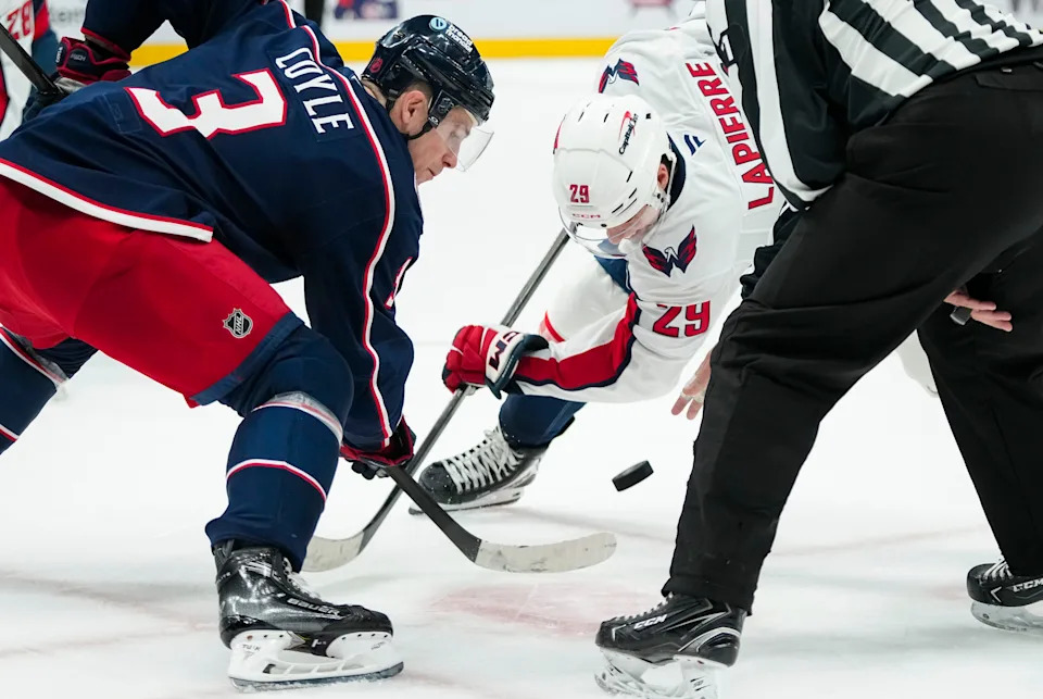 Columbus Blue Jackets center Charlie Coyle (3) takes a faceoff against Washington Capitals forward Hendrix Lapierre (29) during the second period of the NHL preseason hockey game at Nationwide Arena in Columbus on Sept. 30, 2025. The Blue Jackets lost 4-3.