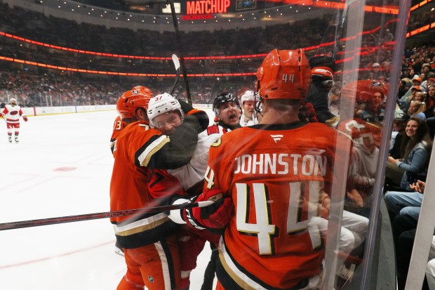 Carolina Hurricanes and Ducks players scuffle during the second period...