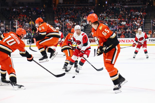 Carolina Hurricanes left wing Taylor Hall (71) fights to control...