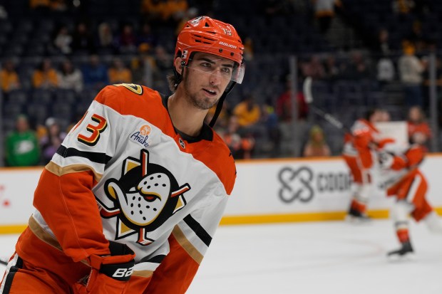Ducks center Nikita Nesterenko (13) warms up before a game...