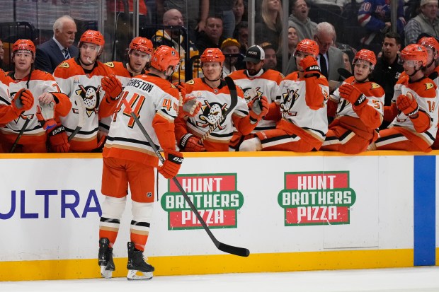 Ducks left wing Ross Johnston (44) celebrates his goal with...
