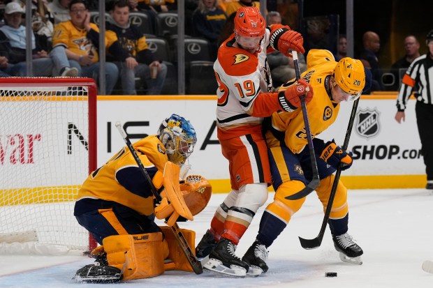 Nashville Predators goaltender Juuse Saros (74) and defenseman Justin Barron...