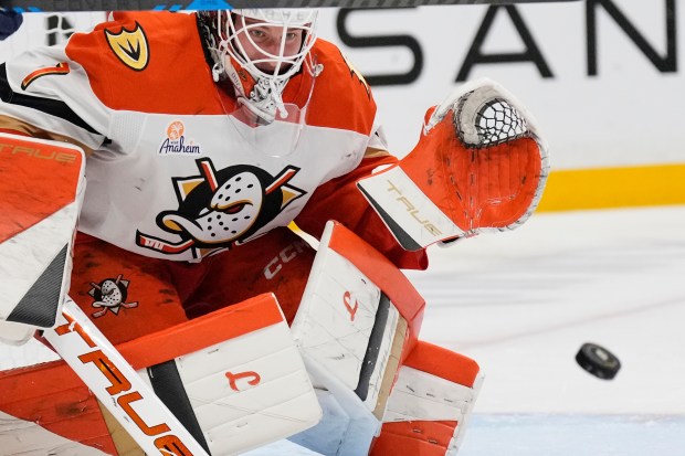 Ducks goaltender Lukas Dostal blocks a shot on goal during...