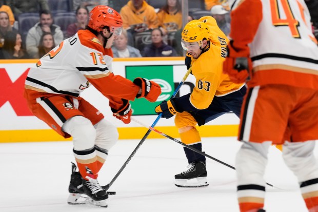 Nashville Predators defenseman Adam Wilsby (83) moves the puck past...