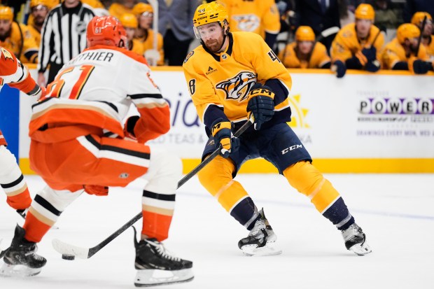 Nashville Predators defenseman Nick Perbix (48) shoots the puck past...