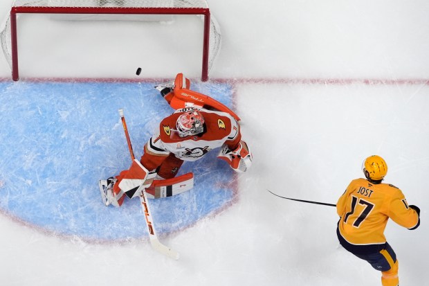 Nashville Predators center Tyson Jost (17) scores a goal past...
