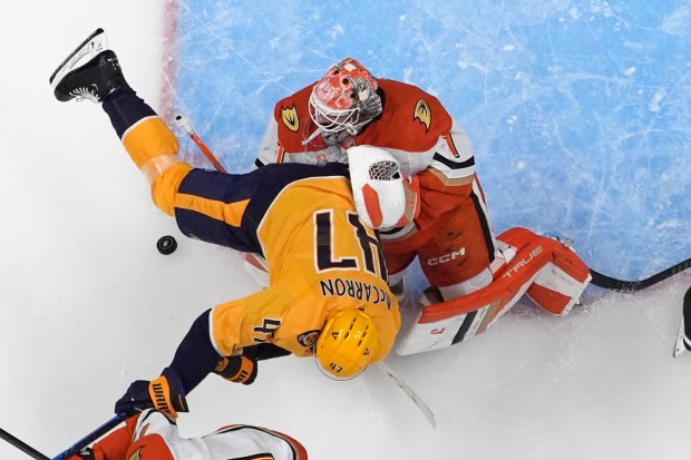 Nashville Predators right wing Michael McCarron (47) collides with Ducks...