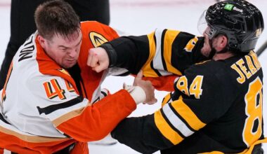 Boston Bruins left wing Tanner Jeannot (84) lands a punch in a fight against Anaheim Ducks left wing Ross Johnston (44) during the second period of an NHL hockey game, Thursday, Oct. 23, 2025, in Boston. (AP Photo/Charles Krupa)