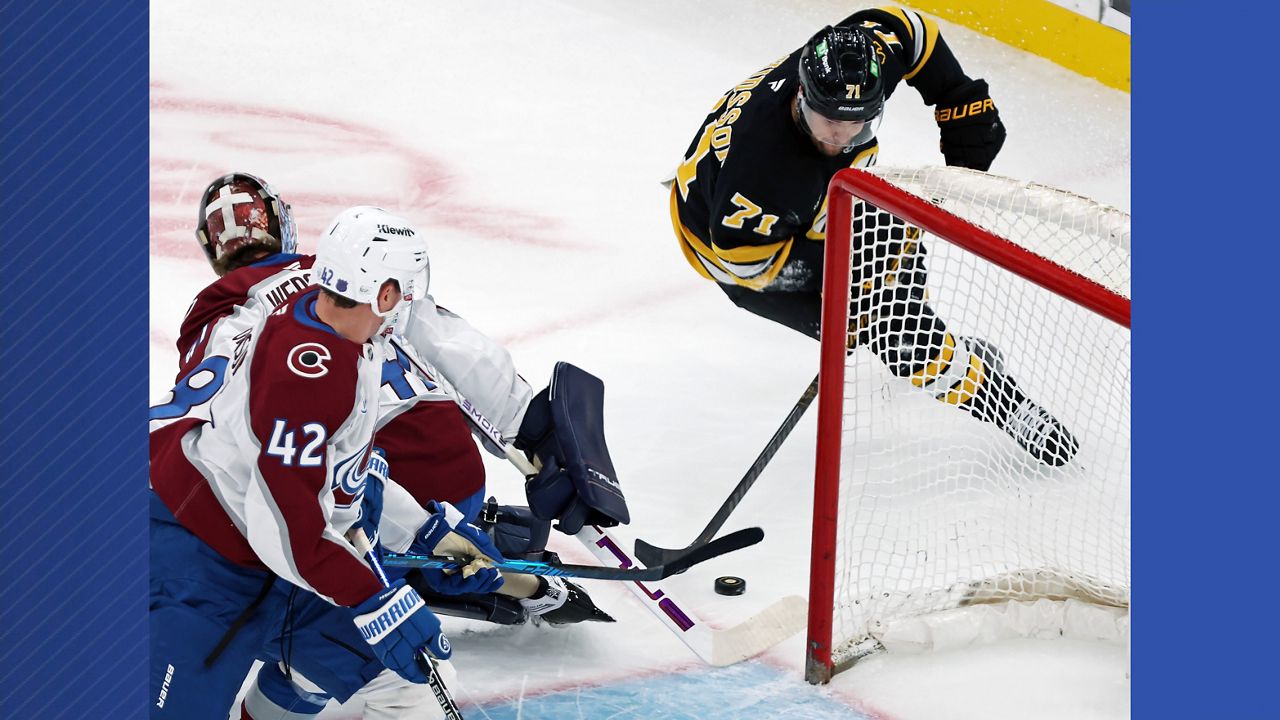 Boston Bruins forward Viktor Arvidsson scores a first period goal, beating Colorado Avalanche goalie Scott Wedgewoo during an NHL hockey game, Saturday, Oct. 25, 2025, in Boston. (AP Photo/Jim Davis)