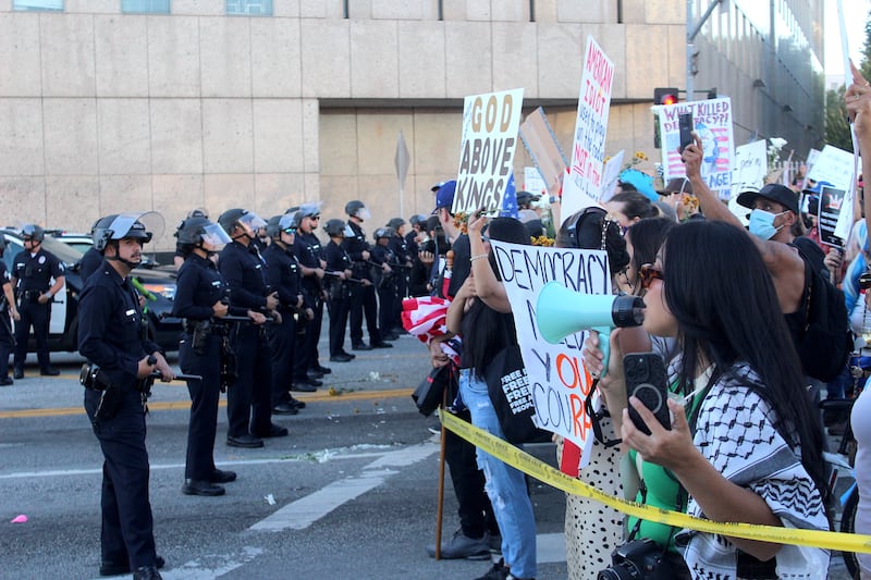 Protestors chant towards LAPD.