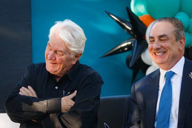 Sharks Owner Hasso Plattner, left, and President of Sharks Sports & Entertainment Jonathan Becher, right, attend a pregame ceremony before the San Jose Sharks' home opener against the Vegas Golden Knights at the SAP Center in San Jose, Calif., on Thursday, Oct. 9, 2025. (Shae Hammond/Bay Area News Group)