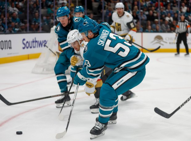 San Jose Sharks' Jeff Skinner (53) fights for the puck against Vegas Golden Knights' Zach Whitecloud (2) in the second period at the SAP Center in San Jose, Calif., on Thursday, Oct. 9, 2025. (Shae Hammond/Bay Area News Group)
