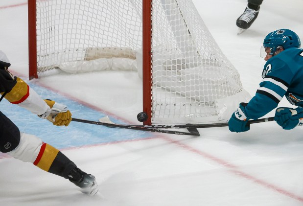 San Jose Sharks' William Eklund (72) nearly makes a goal against Vegas Golden Knights' Shea Theodore (27) in the third period at the SAP Center in San Jose, Calif., on Thursday, Oct. 9, 2025. (Shae Hammond/Bay Area News Group)