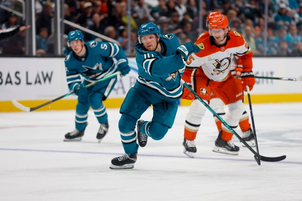 San Jose Sharks' Ty Dellandrea (10) skates on the ice against Anaheim Ducks' Jacob Trouba (65) in the third period at the SAP Center in San Jose, Calif., on Saturday, Oct. 11, 2025. (Shae Hammond/Bay Area News Group)