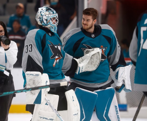 San Jose Sharks goaltender Alex Nedeljkovic (33) and San Jose...