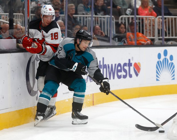 San Jose Sharks' William Eklund (72) fights for the puck...