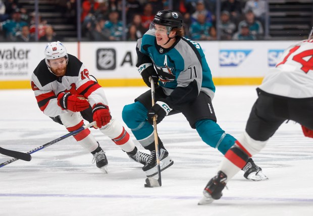 San Jose Sharks' Macklin Celebrini (71) controls the puck against...