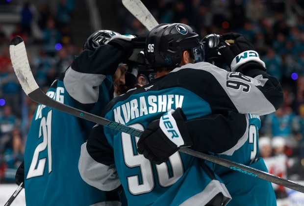 San Jose Sharks' Philipp Kurashev (96) is congratulated on his...