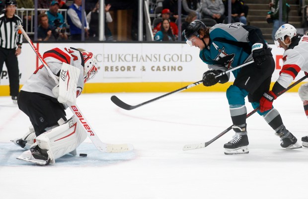 San Jose Sharks' Tyler Toffoli (73) can’t get the puck...