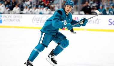 San Jose Sharks' Michael Misa waits as Sam Dickinson makes NHL debut
