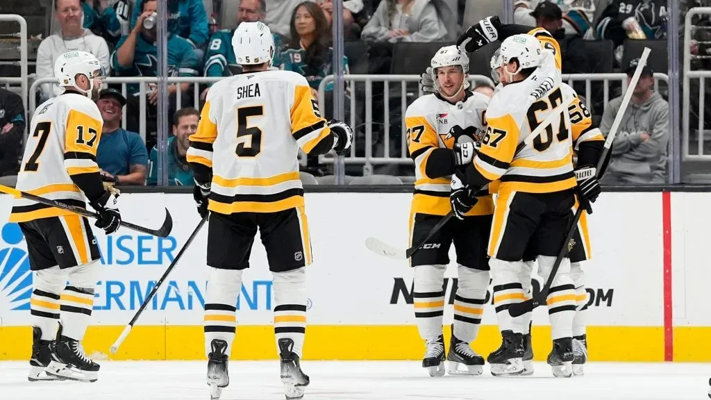 Sidney Crosby #87 of the Pittsburgh Penguins is congratulated by teammates. Thearon W. Henderson/Getty Images
