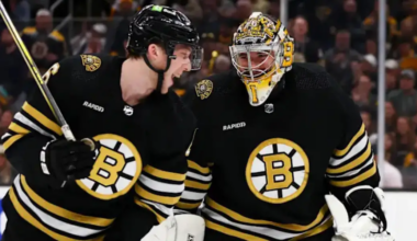 Jeremy Swayman Mason Lohrei skating for the Boston Bruins