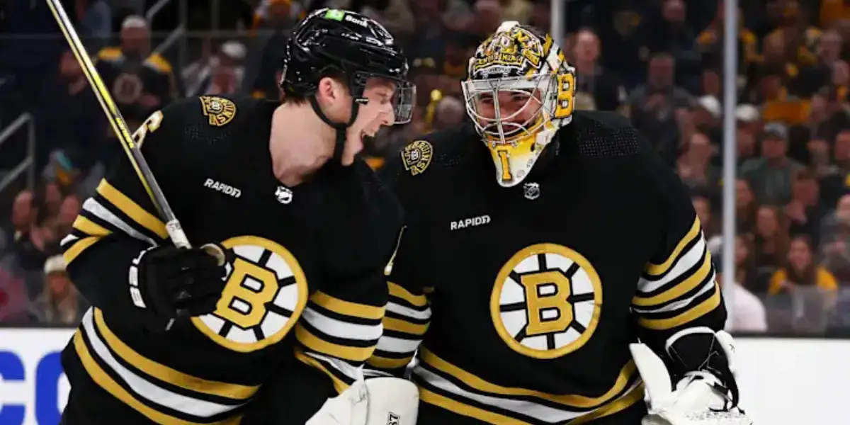 Jeremy Swayman Mason Lohrei skating for the Boston Bruins