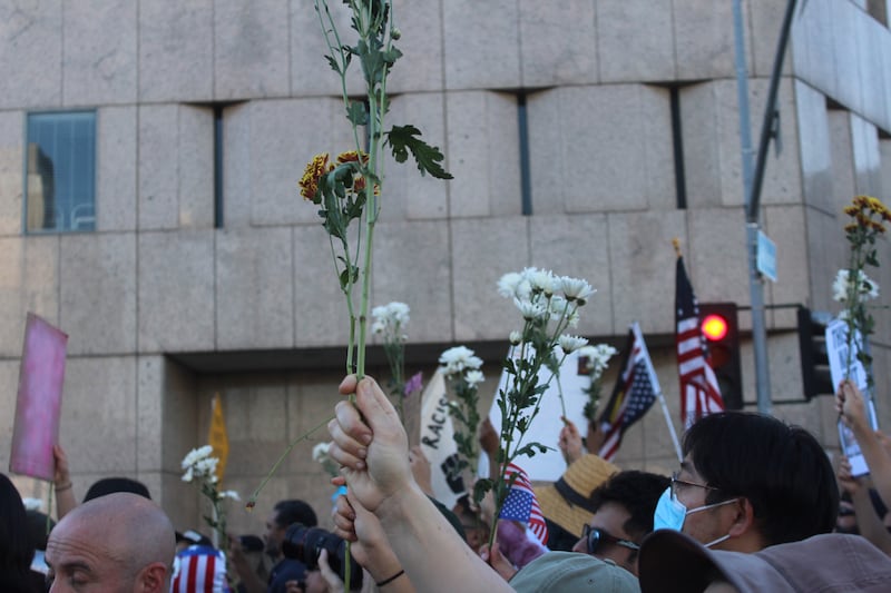 Flowers being held up.