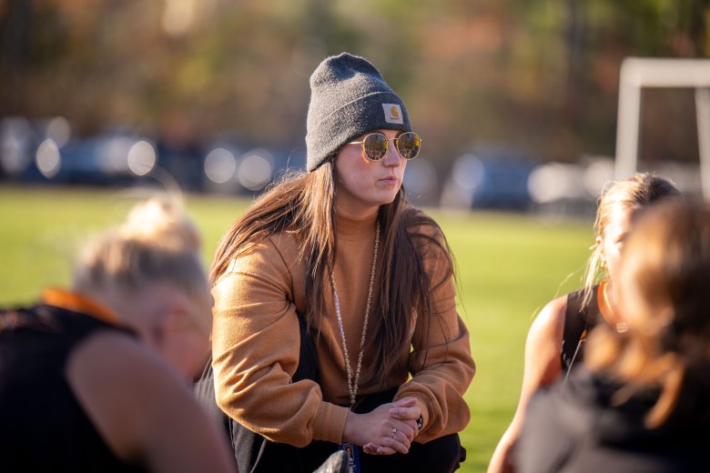 Head coach Ashley Lingerman addresses her team at halftime.