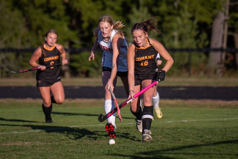 Conant junior captain Mia Lambert battles for a 50/50 ball.