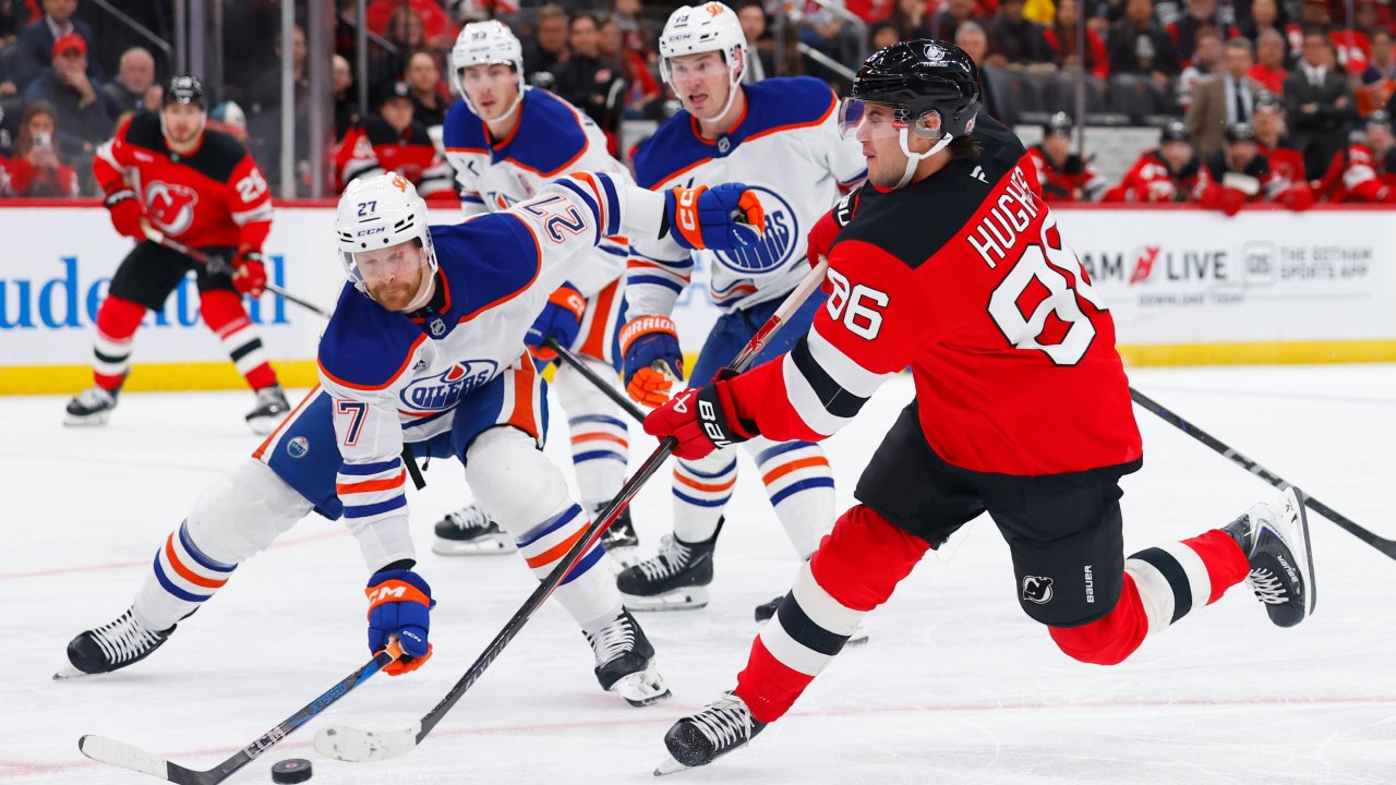 Hughes scores two goals as Devils beat Oilers