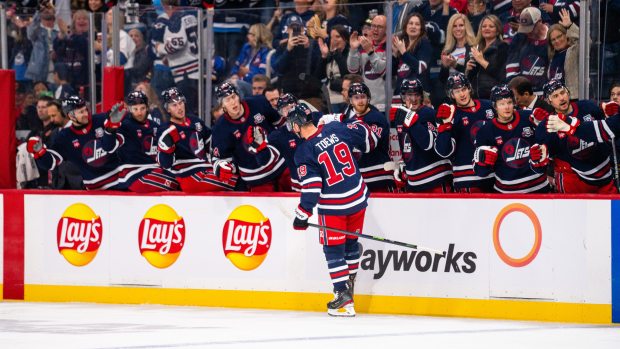 Jonathan Toews of the Jets celebrates his first goal at home with his teammates against the Flames on Oct. 24, 2025, in Winnipeg, Manitoba. (Cameron Bartlett/Getty Images)