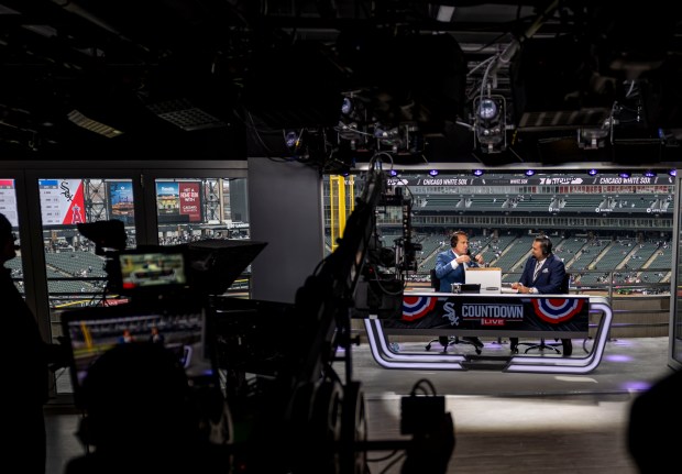 Chicago Sports Network hosts Chuck Garfien and Ozzie Guillen broadcast...