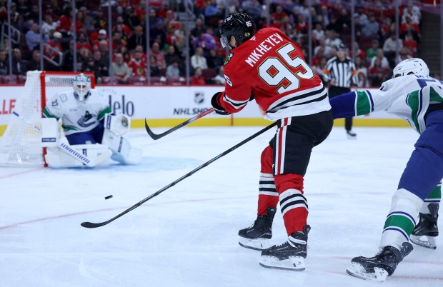 Chicago Blackhawks right wing Ilya Mikheyev (95) takes a shotin the first period of a game against the Vancouver Canucks at the United Center in Chicago on Oct. 17, 2025. (Chris Sweda/Chicago Tribune)