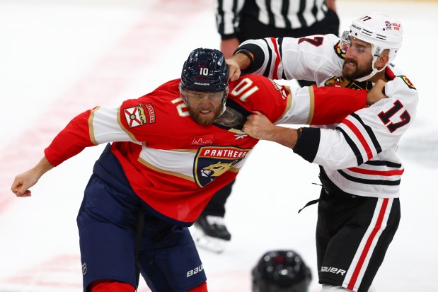 A.J. Greer #10 of the Florida Panthers fights against Nick Foligno #17 of the Chicago Blackhawks during the first period at Amerant Bank Arena on Oct. 07, 2025 in Sunrise, Florida. (Photo by Megan Briggs/Getty Images)