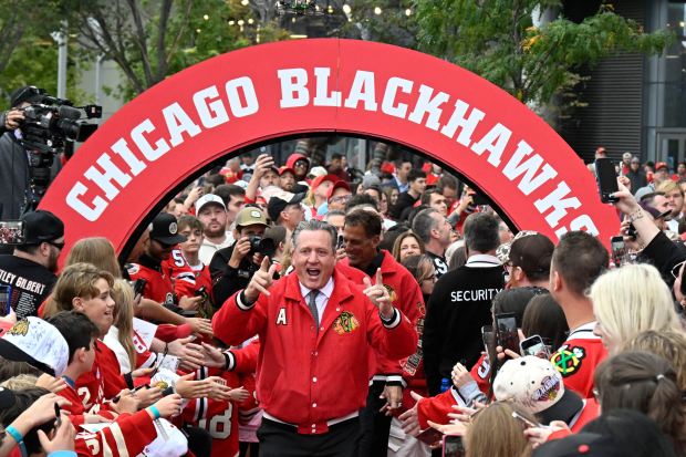 Former Blackhawks great Jeremy Roenick waves to fans while walking on a red carpet before the home opener against the Canadiens on Saturday, Oct. 11, 2025, at the United Center. (Matt Marton/AP)