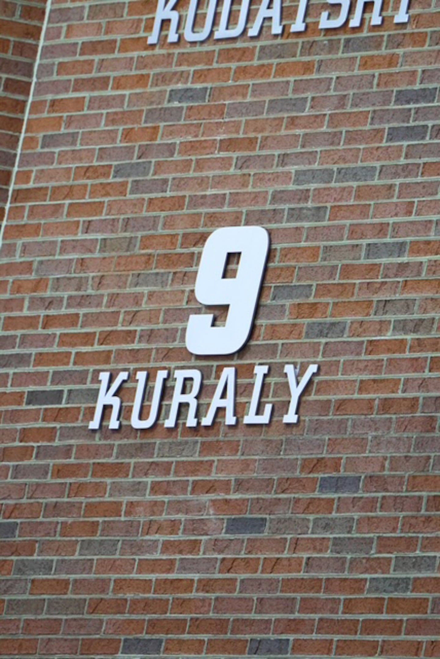 A sign honoring Rick Kuraly is shown outside Goggin Ice Center at Miami University in Oxford, Ohio.