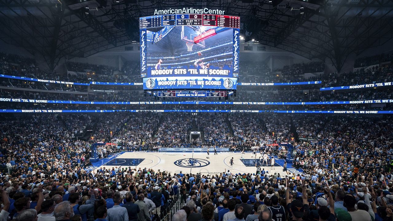 Fans cheers in American Airlines Center during the first half of Game 4 of an NBA basketball first-round playoff series between the Dallas Mavericks and the Los Angeles Clippers, Sunday, April 28, 2024, in Dallas. (AP Photo/Jeffrey McWhorter)