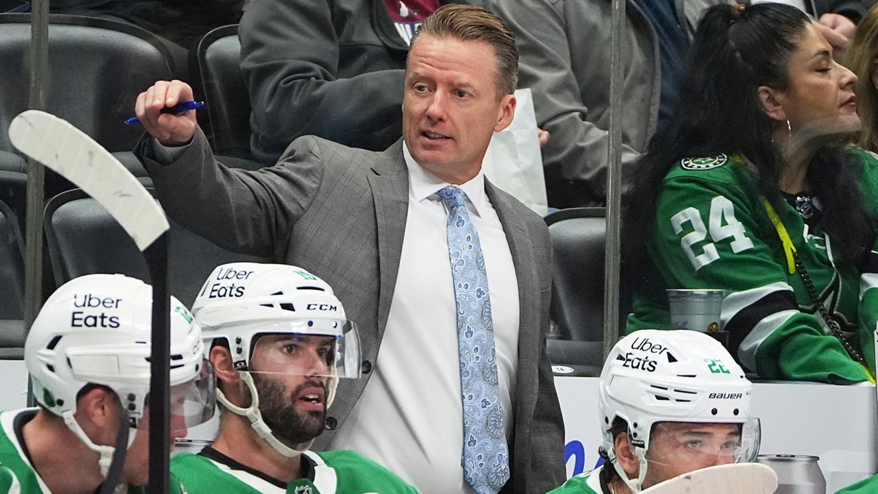 Dallas Stars head coach Glen Gulutzan directs his players in the second period of an NHL hockey game against the Colorado Avalanche, Saturday, Oct. 11, 2025, in Denver. (AP Photo/David Zalubowski)