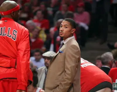 Apr 25, 2013; Chicago, IL, USA; Chicago Bulls point guard Derrick Rose (center) on the bench during a time out in the first quarter of the first round of the 2013 NBA playoffs against the Brooklyn Nets at the United Center.