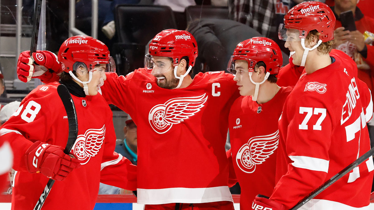 Detroit Red Wings center Dylan Larkin (71) celebrates with his teammates after scoring a goal against the Edmonton Oilers during the second period at Little Caesars Arena.