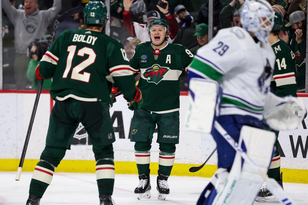 Minnesota Wild left wing Kirill Kaprizov, middle, celebrates his goal against the Vancouver...
