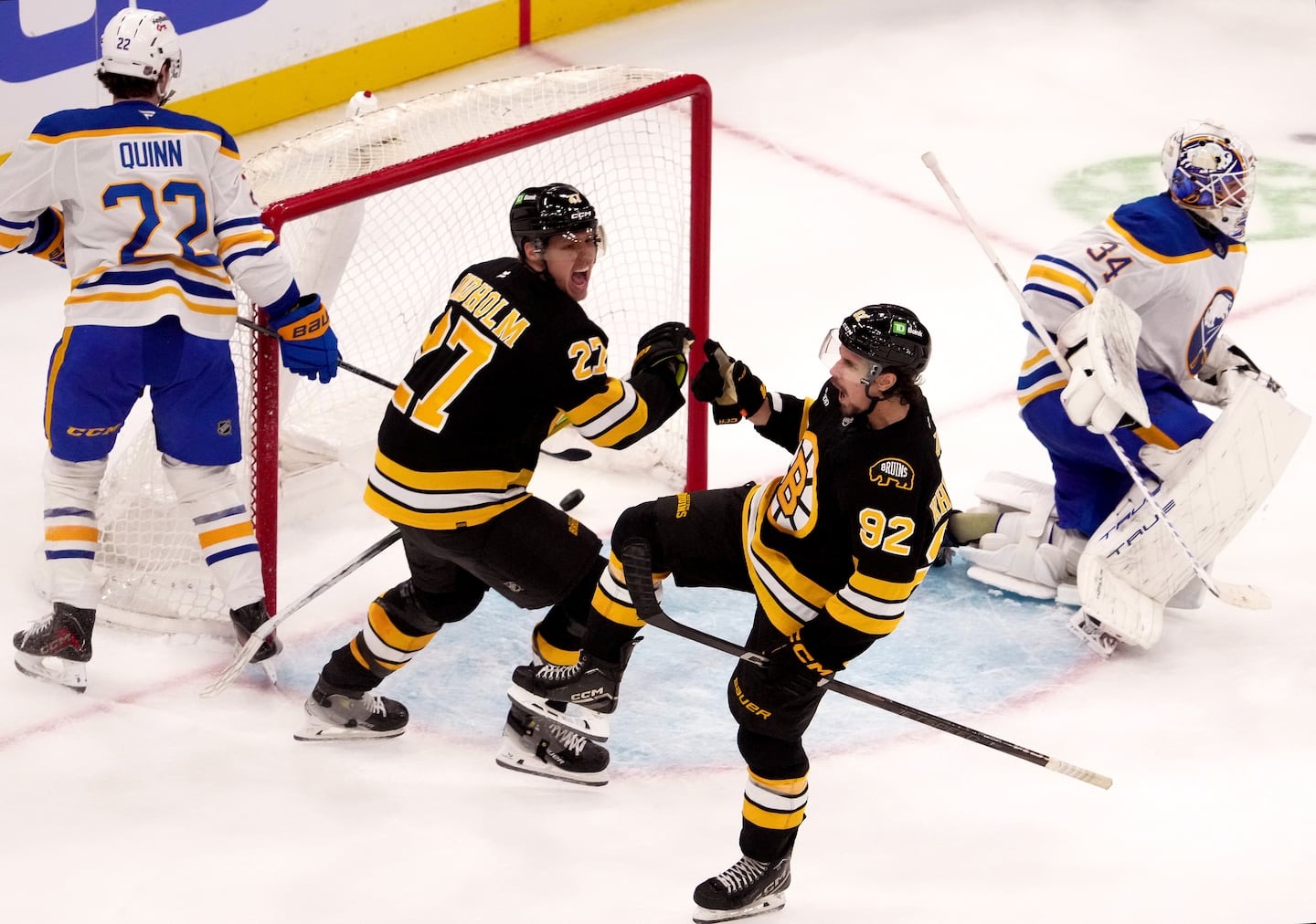 Marat Khusnutdinov (second from right) celebrated with Hampus Lindholm after scoring in overtime to lift the Bruins past the Sabres.