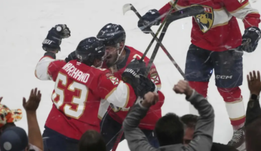 Marchand celebrating his OT game-winning goal with Kulikov. (AP Photo/Marta Lavandier)