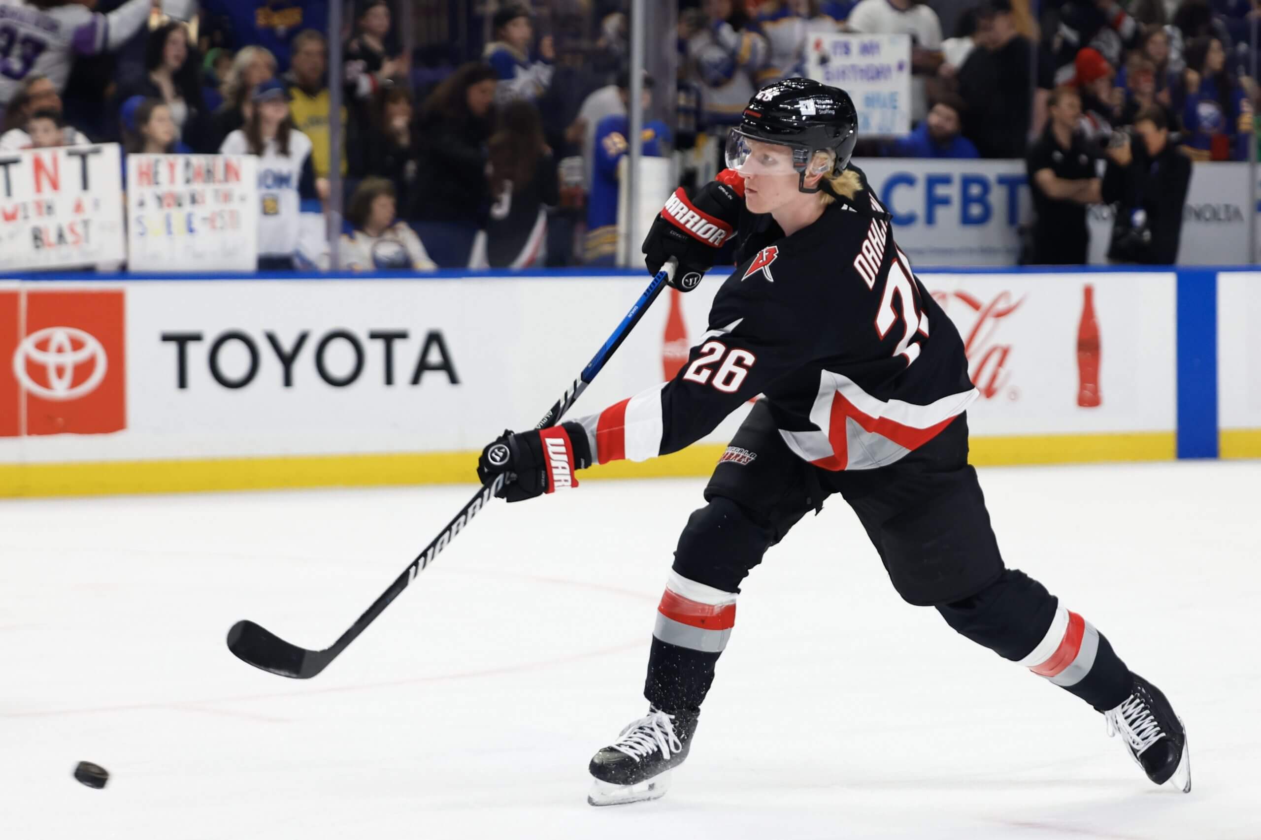 Buffalo Sabres captain Rasmus Dahlin takes a shot during warmups.