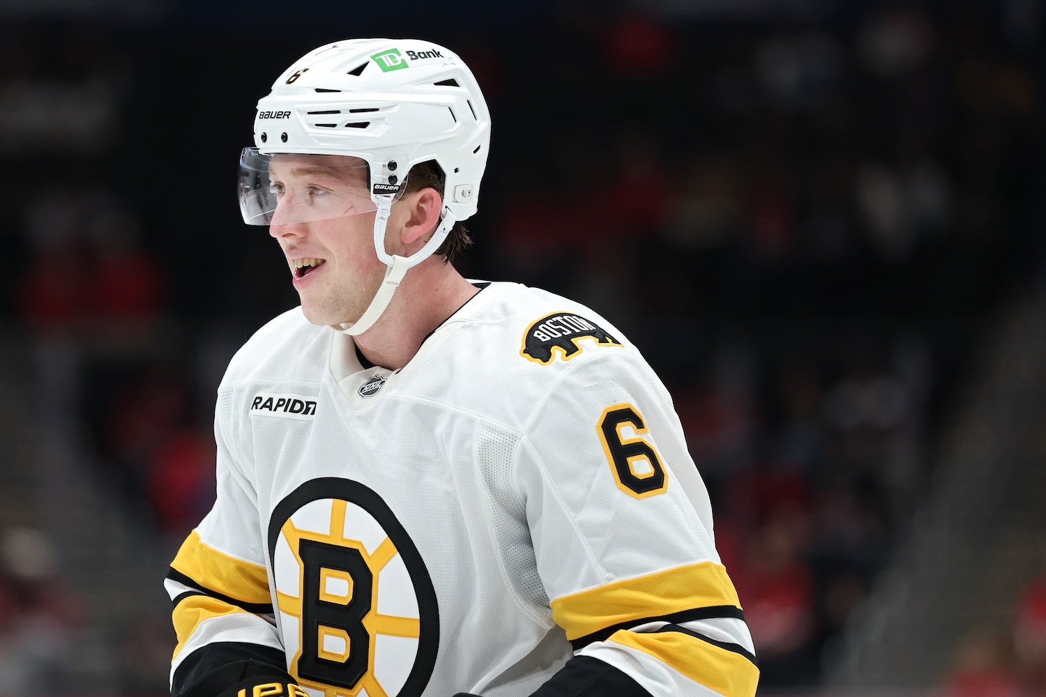WASHINGTON, DC - OCTOBER 02: Mason Lohrei #6 of the Boston Bruins looks on against the Washington Capitals in the first period during a preseason game at Capital One Arena on October 2, 2025 in Washington, DC. (Photo by Patrick Smith/Getty Images)