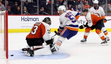PHILADELPHIA, PENNSYLVANIA - OCTOBER 02: Emil Heineman #51 of the New York Islanders scores a goal past Samuel Ersson #33 of the Philadelphia Flyers during the third-period of a preseason game at Xfinity Mobile Arena on October 02, 2025 in Philadelphia, Pennsylvania.