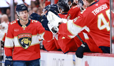 Carter Verhaeghe #23 of the Florida Panthers high fives teammates after scoring against the Chicago Blackhawks during the first period at Amerant Bank Arena on October 07, 2025 in Sunrise, Florida.