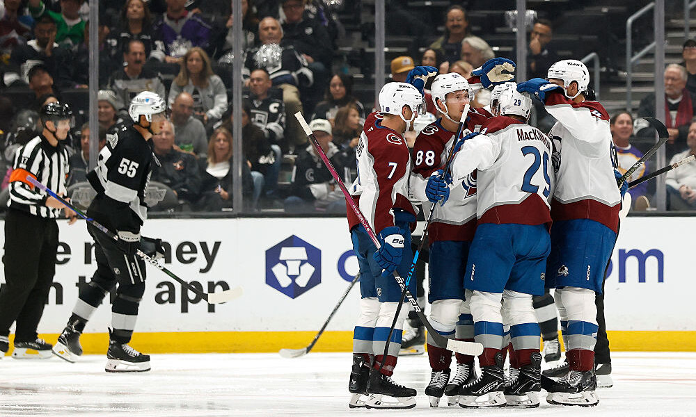 Nathan MacKinnon makes Avs history, Colorado rolls in season opener
