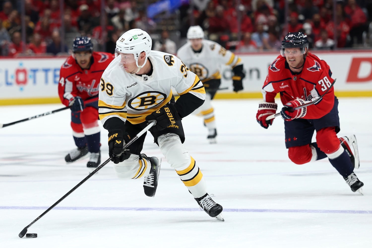 WASHINGTON, DC - OCTOBER 08: Morgan Geekie #39 of the Boston Bruins skates with the puck against the Washington Capitals during the first period at Capital One Arena on October 8, 2025 in Washington, DC. (Photo by Patrick Smith/Getty Images)